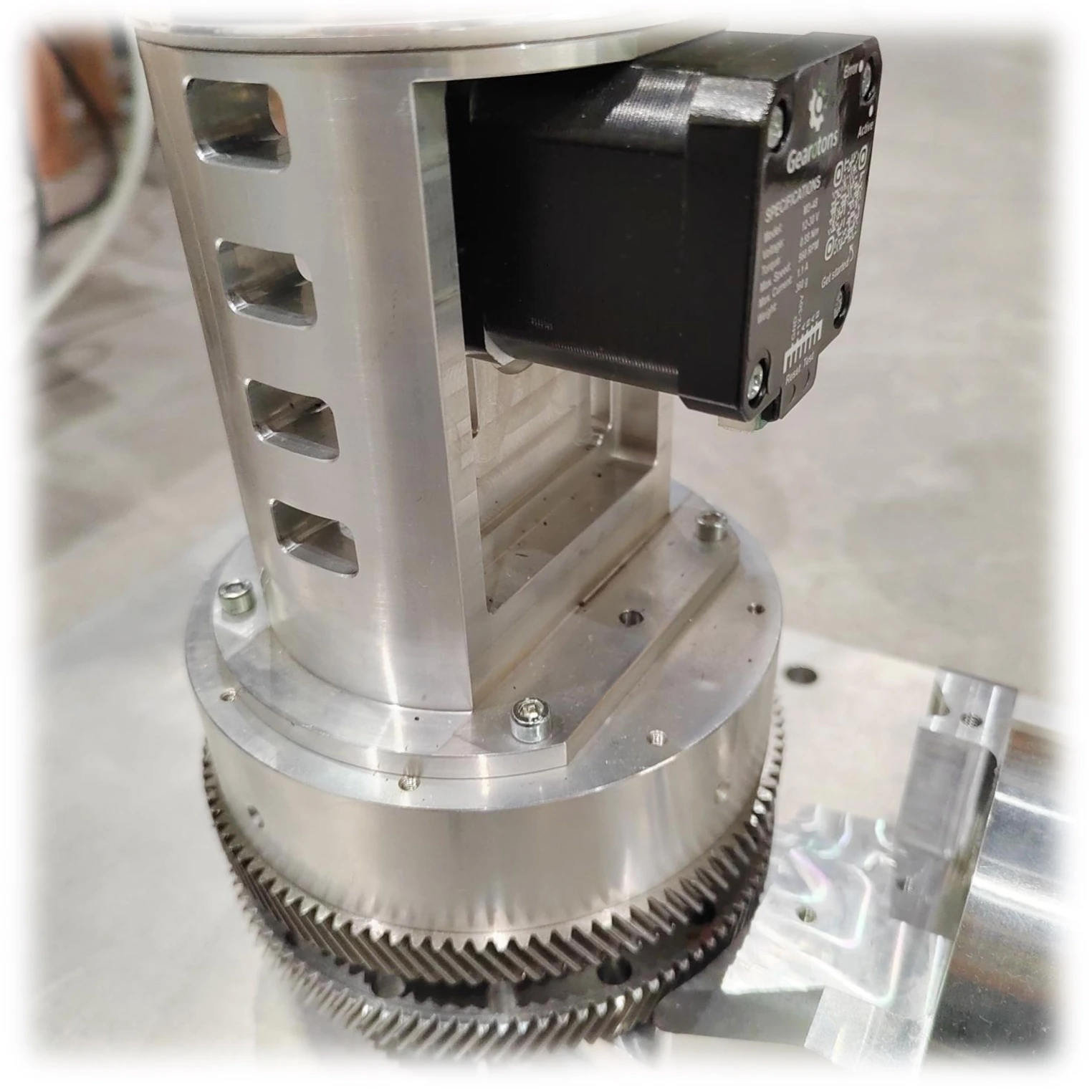 An M17 motor in a CNC and robotics metal assembly driving a large gear